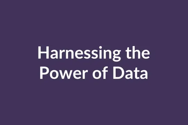 zensmart is showing Animated graph bars of varying heights and colors, set against a purple background, surge upward as text changes with each transition mid-animation. The texts read "Harnessing the Power of Data," "Intelligent Data Analytics," "Better Management," and "Driving Innovation. with print workflow automation